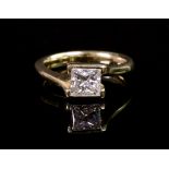 An 18ct gold and diamond single-stone ring, the Princess-cut diamond measuring approximately 5.