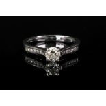 A platinum and diamond single-stone ring,
