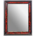 A scarlet tortoiseshell veneered and ebonised frame upright wall mirror,
