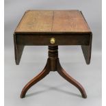 A George III oak breakfast table, with rounded hinged drop leaves, end drawer,