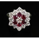 An 18ct gold, ruby and diamond dress ring of cluster design,