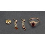 A gold and garnet set ring, ring size M , 1.