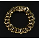 An 18ct gold bracelet of double circular-link design to a box and tongue clasp and safety clasp,
