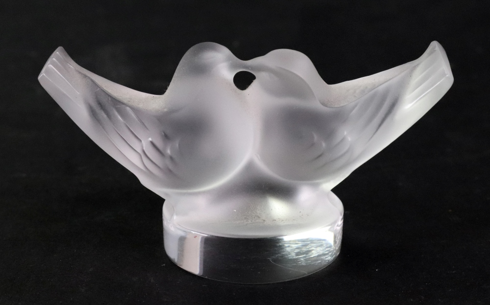 A Lalique crystal kissing doves paperweight, etched Lalique France, 4.5cm high. Illustrated.