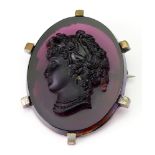 A Victorian amethyst coloured glass portrait brooch,