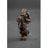 A carved wood Japanese netsuke of a dragon, signed to leg, 6.5cm high.