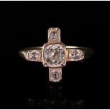 A diamond-set cross ring, the central old mine-cut diamond, in a rub-over rectangular setting,