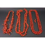 A single strand red coral necklace, set with coral fronds of graduated design,