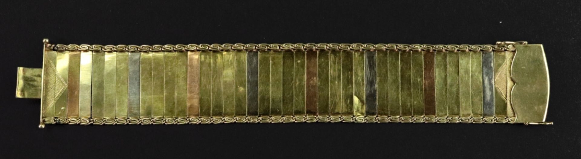 A 14ct tri-gold fancy-link bracelet designed as a wide textured strap, - Image 2 of 2