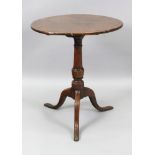 A George III oak pedestal table, the circular top, on a vase turned pillar and tripod base,