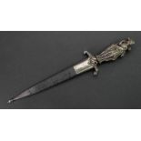 A silver handled dagger, cast as three standing figures dressed in period costume,