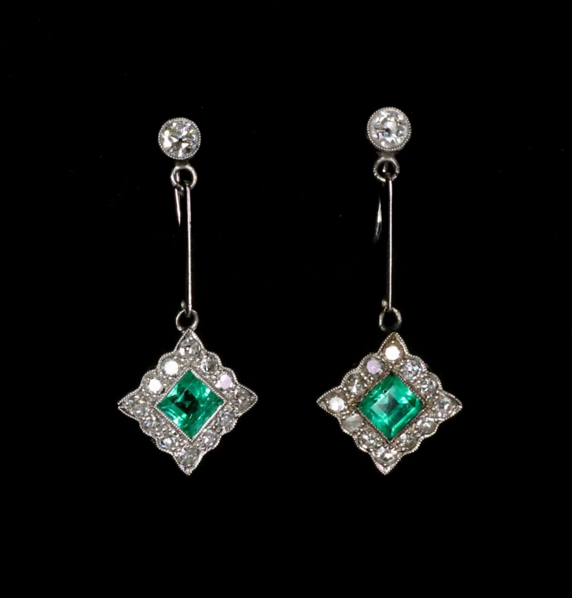 A pair of 18ct white gold, emerald and diamond pendant earrings,