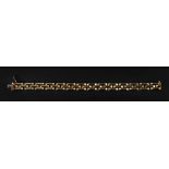 A 9ct gold fancy brick-link bracelet, to a box and tongue clasp and single safety clasp,