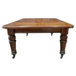 A late Victorian mahogany extending dining table,