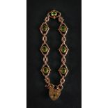 A 9ct rose gold and peridot-set bracelet, of lozenge shaped fancy-link design,