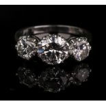 An 18ct white gold and diamond three-stone ring, total diamond weight approximately 2.