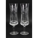 A set of 23 vine etched and split cut glass champagne flutes.