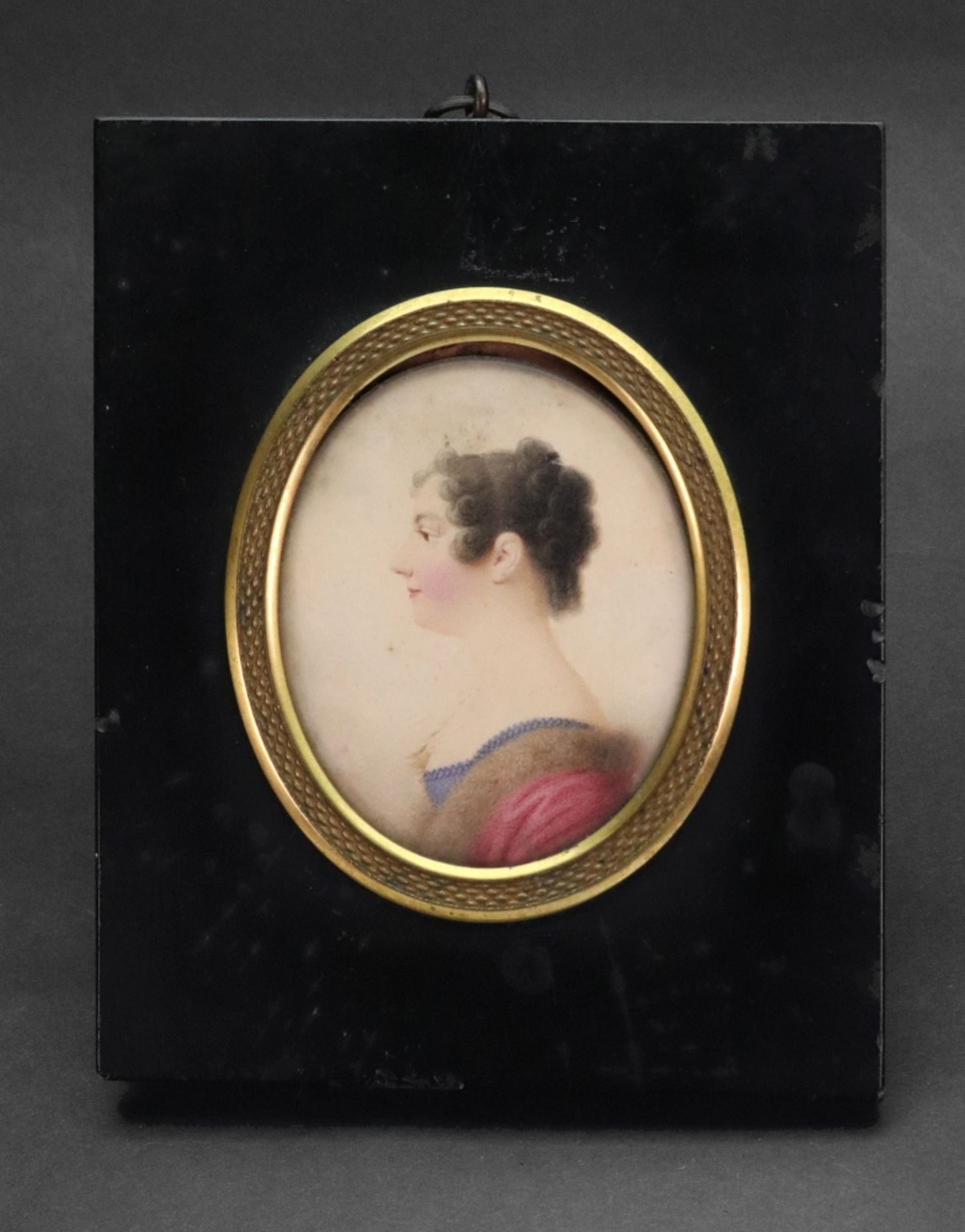 English School, 19th Century, A portrait miniature of a lady in profile, watercolour, 8 x 6.5cm.