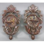 A pair of North Italian carved wood and silvered wall brackets, 18th century,