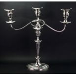 An Old Sheffield plate candelabrum, in Adam style, with reeded scrolling branches,