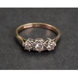A 9ct gold and three-stone diamond ring, the circular-cut diamonds,