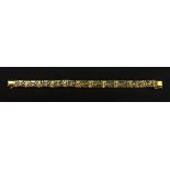 A gold fancy-link bi-gold bracelet, composed of alternating double X and cross links,