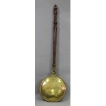 An early 19th century brass warming pan,