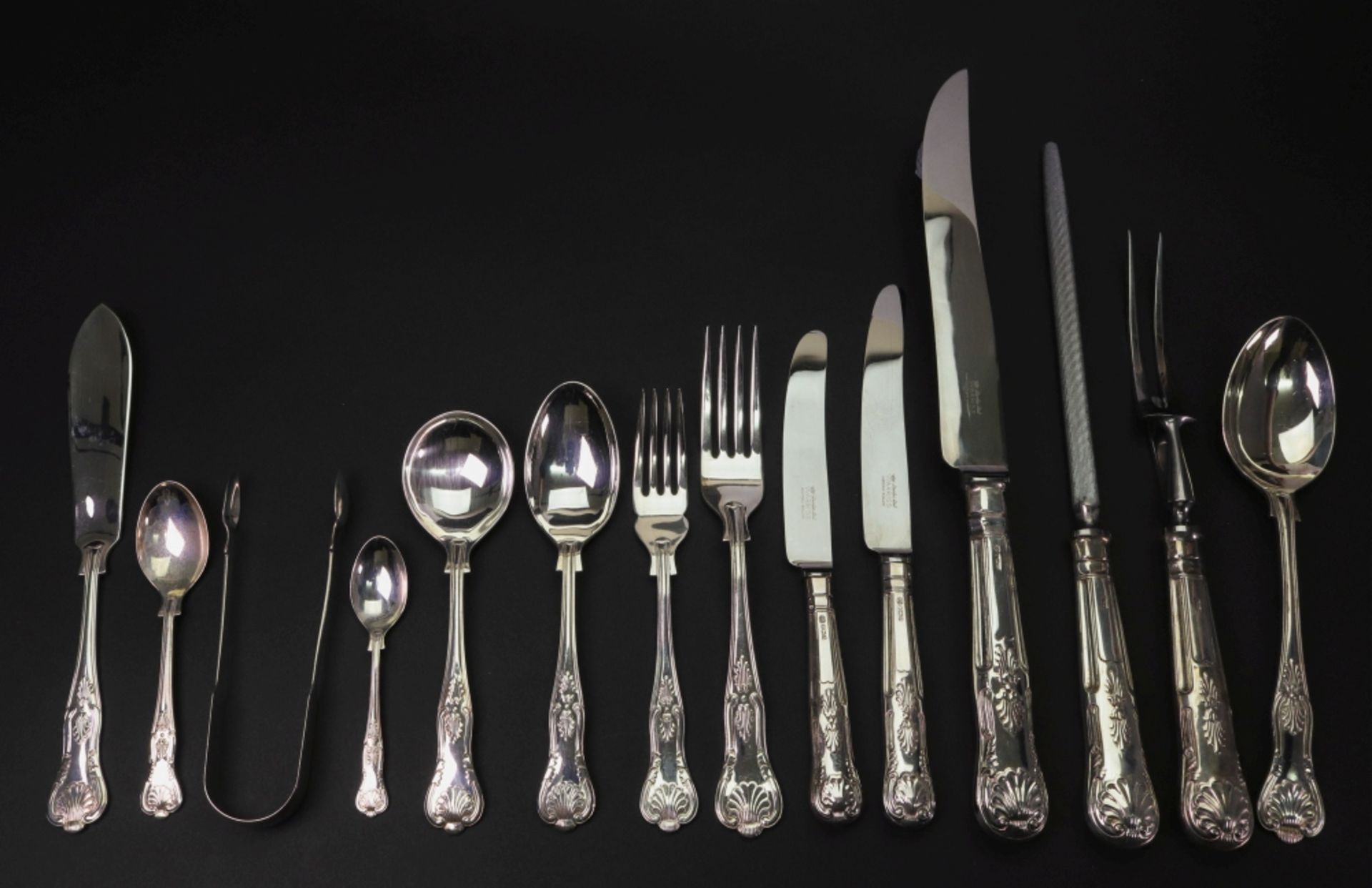 A walnut cased canteen of Kings pattern silver flatware and cutlery, Sheffield 1980, Warriss,