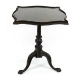 A Chippendale Revival mahogany pedestal table, the square galleried top of serpentine outline,