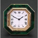 Cartier Paris; a gilt metal octagonal cased alarm clock, with green faux tortoiseshell surround,