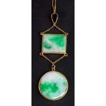 A gold and jade two stone pendant,