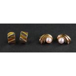 A pair of cultured pearl and yellow precious metal earclips, of scrolling design,