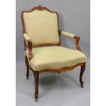 A Louis XV walnut frame fauteuil, carved with scallop shells and leaf scrolls,