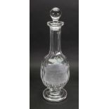 A Waterford facet cut glass decanter, inscribed with a presentation inscription '...