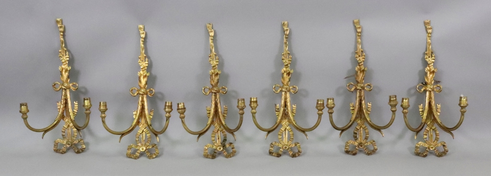 A set of six gilt metal twin branch wall applique, in Regency style,