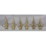 A set of six gilt metal twin branch wall applique, in Regency style,