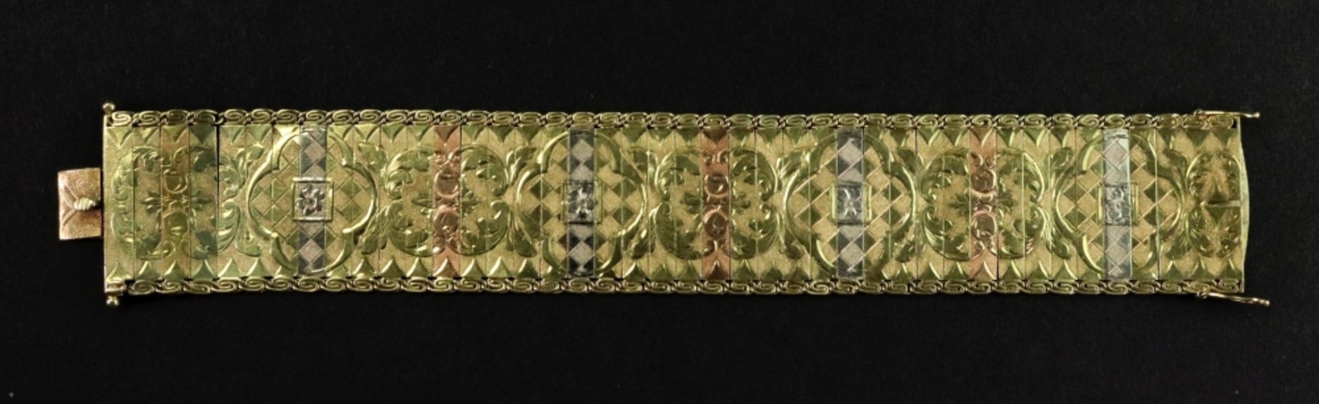 A 14ct tri-gold fancy-link bracelet designed as a wide textured strap,