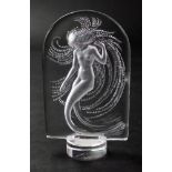 A Lalique crystal mermaid paperweight, etched Lalique France, 10cm high. Illustrated.