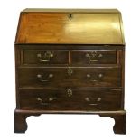 A mahogany bureau, of small proportions, reconstructed from a larger George III bureau,