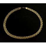 A 9ct gold necklace, of an interwoven design, detailed '9KT 375' 10.9g.