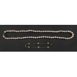 A single strand cultured pearl necklace of graduated design,