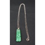 A diamond-set jadeite pendant necklace, the diamond-set pendant of tapered rectangular design,