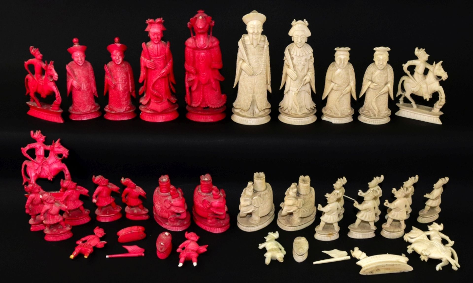 A Chinese carved ivory chess set, 19th century, one half stained red, the other natural, Kings 10. - Image 2 of 2