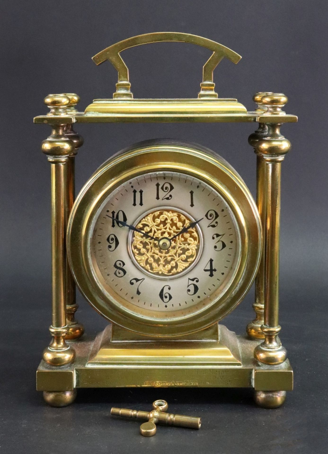 A late Victorian brass cased mantel timepiece,