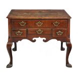 A George II oak and featherbanded lowboy,