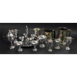 A collection of electroplate tennis and golf trophies,