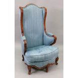 A Louis XV moulded walnut frame chauffeuse, with a high arched upholstered wing back,