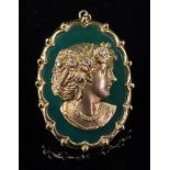 A 9ct gold mounted, dyed green agate and diamond-set pendant, centred by a cast portrait of a girl,