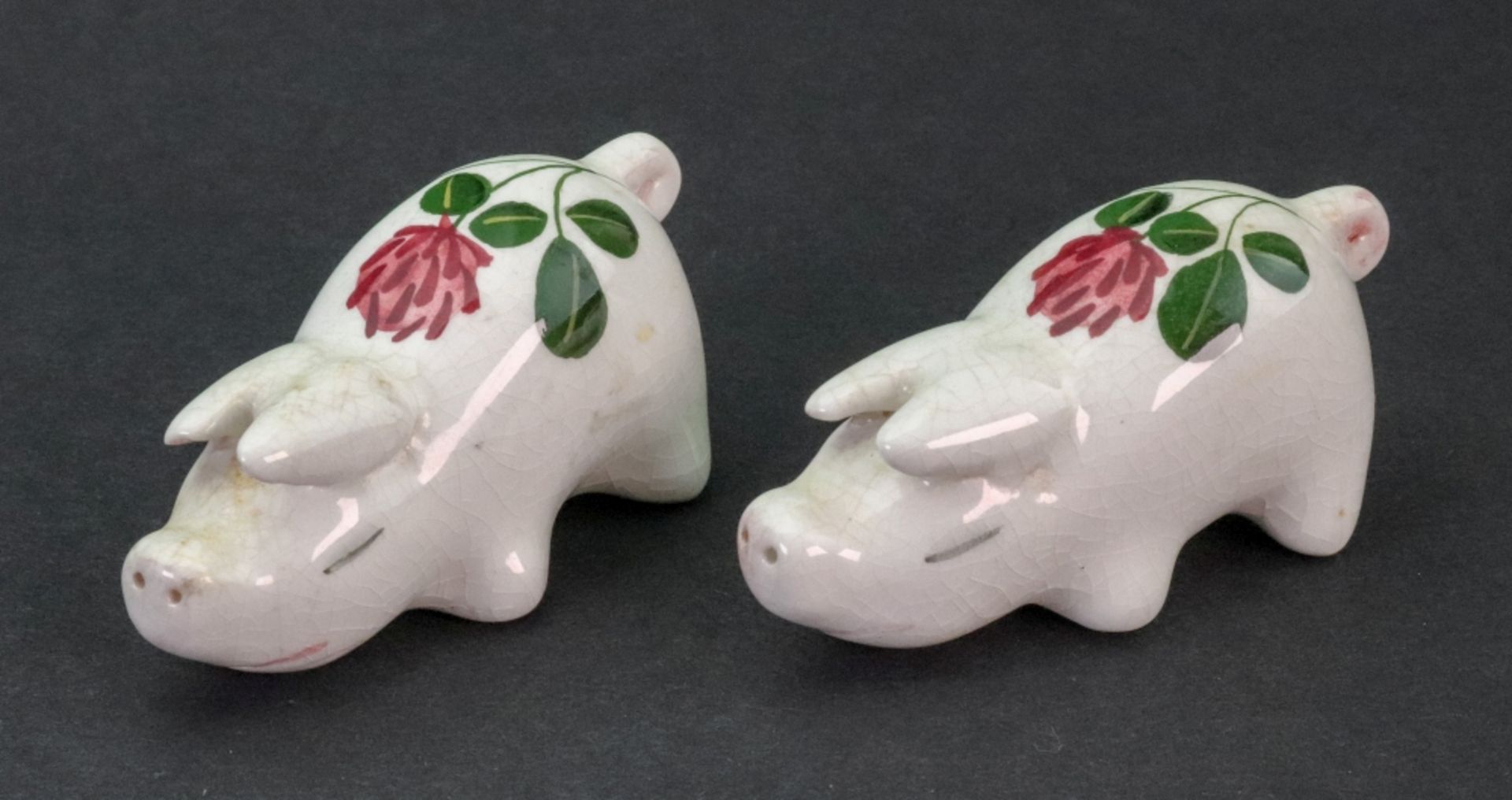 A pair of Plichta miniature figures of pigs, 3cm high x 7cm wide.