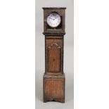 A miniature reproduction George III style oak longcase clock, with ebonised bandings,